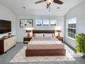 Inviting main bedroom featuring three windows and a ceiling fan at 1491 Ophir Rd, Castle Rock, CO 80109