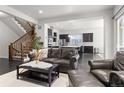 Open-concept living area flowing into the kitchen, perfect for entertaining and Gathering gatherings at 1867 W 137Th Ln, Broomfield, CO 80023