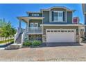 Two-story home with a two-car garage and brick driveway at 1086 Highlands Dr, Erie, CO 80516