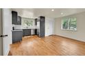 Open concept kitchen and dining room with lots of light, stainless steel appliances and hardwood floors at 495 Quebec St, Denver, CO 80220
