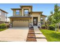 Charming two-story home with landscaped yard, stone accents, and attached two-car garage at 11089 Woodhurst Cir, Highlands Ranch, CO 80130