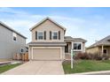 Charming two-story home with a well-maintained lawn and a two-car garage at 16175 Peregrine Dr, Parker, CO 80134