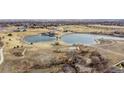 Scenic aerial view of community lakes, green spaces, and recreational area at 3137 E 112Th Pl, Thornton, CO 80233