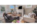 Cozy living room featuring comfortable seating and a fireplace at 3764 N Raleigh St, Denver, CO 80212