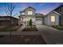 Charming two-story home with stone accents and a well-manicured front yard at 9396 Bear River St, Littleton, CO 80125