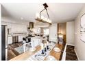 Spacious kitchen showcases an island, stainless steel appliances, and an adjacent dining area at 1255 S Welch Cir, Lakewood, CO 80228