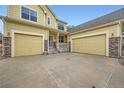 Two-story home with a large driveway and a spacious three-car garage at 22991 Hope Dale Ave, Parker, CO 80138