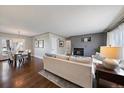 Open concept living and dining area with hardwood floors and lots of natural light at 5450 Flower Ct, Arvada, CO 80002