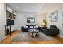 Cozy living room, featuring a comfortable couch and a large TV at 1248 Perry St, Denver, CO 80204