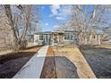 Single-story home with a simple but well-maintained landscape and a front walkway at 901 S Osceola St, Denver, CO 80219