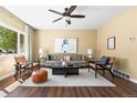 Stylish living room featuring hardwood floors, contemporary furnishings, and a bright, airy atmosphere at 845 S Kenton St, Aurora, CO 80012