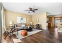 Bright living room with modern decor, hardwood floors, and an open layout at 845 S Kenton St, Aurora, CO 80012