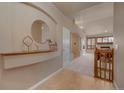 Elegant foyer with decorative accents, opening to a spacious living area with a cozy fireplace at 9040 Grand Mesa Ave, Longmont, CO 80504