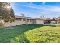 Classic single-story home with a spacious front yard and a convenient attached two-car garage at 772 Urban Ct, Lakewood, CO 80401