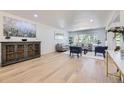 Spacious living room featuring hardwood floors, stylish decor and a large window at 2101 Champlain Dr, Boulder, CO 80301