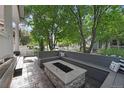 Outdoor patio area with built-in seating and a fire pit at 2813 Central Park Blvd, Denver, CO 80238