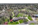 An aerial view of the estate home and beautiful tree-lined property at 21 Huntwick Ln, Cherry Hills Village, CO 80113