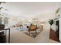 Open-concept living space with fireplace and lots of room for activities at 3942 E Evans Ave, Denver, CO 80210