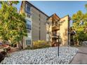 Exterior shot of apartment complex with white rock landscaping at 2281 S Vaughn Way # 118A, Aurora, CO 80014