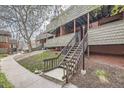 A multi-Gathering building with wood facade and siding, featuring private balconies and exterior staircases at 3050 W 32Nd Ave # 102C, Denver, CO 80211