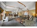 Spacious living room offers modern decor with open concept kitchen and dining area at 422 Willow Dr, Lochbuie, CO 80603