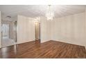 Spacious dining room with hardwood floors and a chandelier at 14050 E Linvale Pl # 312, Aurora, CO 80014