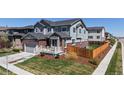 Well-kept two-story home with manicured lawn and fenced backyard, perfect for outdoor enjoyment at 12828 Fox Ct, Westminster, CO 80234