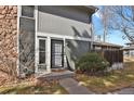 Charming front entrance featuring neutral siding and a well-manicured lawn and walkway at 10001 E Evans Ave # 58B, Aurora, CO 80247