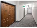 Building hallway with carpet and doors to units at 1551 Larimer St # 2805, Denver, CO 80202