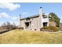 Low angle exterior view of a two story home with neutral siding and well-maintained landscaping at 4333 S Andes Way # 203, Aurora, CO 80015