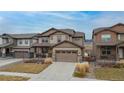 Beautiful two-story home with a spacious two car garage and manicured front yard at 8827 Gore St, Arvada, CO 80007