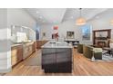 Modern kitchen with a large island, marble countertops, and high-end appliances at 817 29Th St, Denver, CO 80205