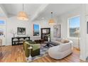 Light-filled living room with hardwood floors, comfortable seating, and a stylish coffee table at 817 29Th St, Denver, CO 80205