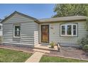 Charming home featuring a well-maintained lawn and inviting curb appeal at 1140 S Xavier St, Denver, CO 80219