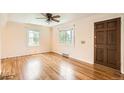 Bright living room features hardwood floors and plentiful natural light at 1140 S Xavier St, Denver, CO 80219