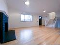 Inviting living room showcasing hardwood floors, a fireplace, and abundant natural light at 3530 Dahlia St, Denver, CO 80207