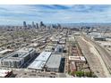 Wide aerial shot showcasing the Denver skyline and surrounding urban landscape at 3195 Blake St # 106, Denver, CO 80205