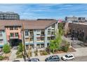 Multi-story condo building boasting a modern facade and well-maintained landscaping at 3195 Blake St # 106, Denver, CO 80205