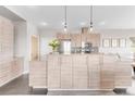 Modern kitchen with light wood cabinets and stainless steel appliances at 8408 Vinegarroon Rd, Parker, CO 80138