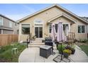 A backyard patio with a grill, planters, and various seating options perfect for outdoor relaxation at 6581 W Alamo Dr, Littleton, CO 80123