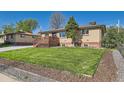 Beautiful one-story home with a well-maintained front lawn and inviting curb appeal at 3871 Moore St, Wheat Ridge, CO 80033