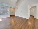 Spacious living room with hardwood floors, tall ceilings, and a staircase at 5966 S Winnipeg St, Aurora, CO 80015