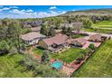 Spacious home with beautiful landscaping, mature trees, and a large, well-maintained yard, great for outdoor activities at 15325 W 32Nd Ave, Golden, CO 80401