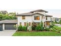 Lovely two-story home with an attached garage and beautifully landscaped surroundings at 5455 E Cedar Ave, Denver, CO 80246