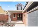 Attractive brick front entry with double doors and sidelights at 7079 S Locust Pl, Centennial, CO 80112