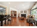 Spacious living room with hardwood floors and fireplace at 7956 S Eudora Cir, Centennial, CO 80122