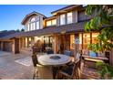 Evening view of patio with seating area and lighting at 7956 S Eudora Cir, Centennial, CO 80122