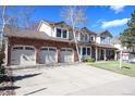 Beautiful two-story house boasts a three-car garage, well-kept lawn, and a 'For Sale' sign, ready for its next owners at 11418 W Roxbury Ave, Littleton, CO 80127