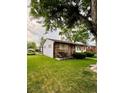 Charming single-story home featuring a stone facade and well-manicured lawn at 3231 S Galapago St, Englewood, CO 80110