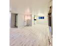 Bright living room with light gray walls and luxury vinyl plank flooring at 3231 S Galapago St, Englewood, CO 80110